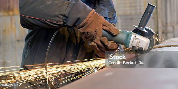 Sparks When Machining A Weld Bead On The Pipe Stock Photo - Download Image Now - Factory, Iron - Metal, Occupation
