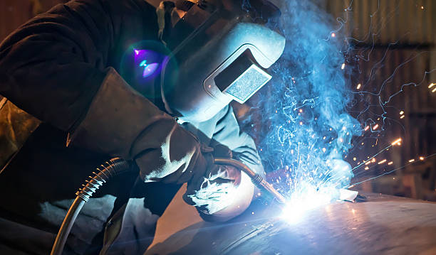 istock Semi-automatic welding with sparks and smoke 636279254