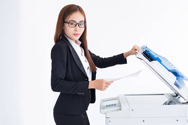 istock Content Asian Business Woman Using Copier Machine 636279590