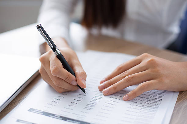 istock Cropped View of Person Working with Document 636279680