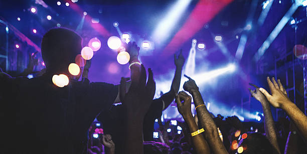 istock People at concert party. 636283296