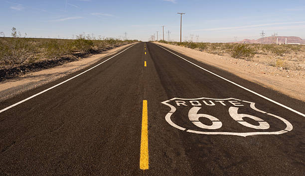 istock Rural Route 66 Two Lane Historic Highway Cracked Asphalt 636283982