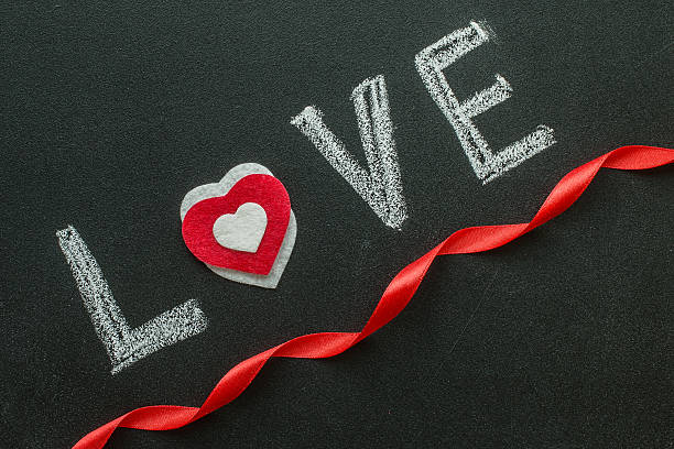 istock the word love on the chalkboard. 636285626