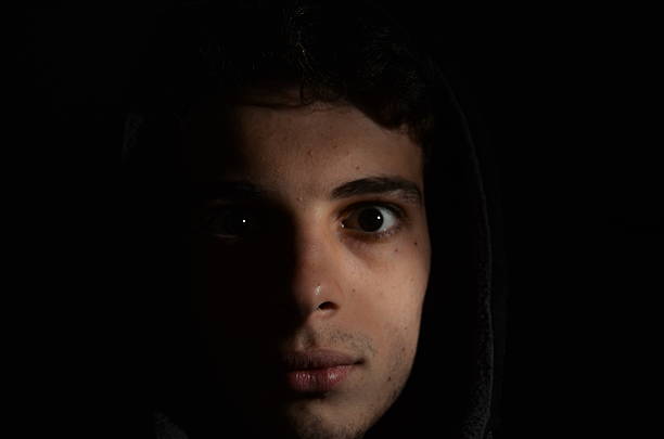 istock White Dark Man Hood Sweatshirt 636288018
