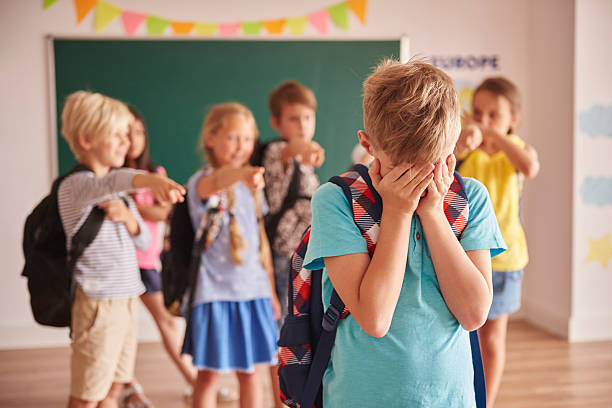 Picture showing children violence at school Picture showing children violence at school teasing stock pictures, royalty-free photos & images