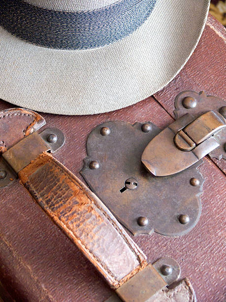 istock Man's Fedora Hat and Leather Suitcase III 636289152