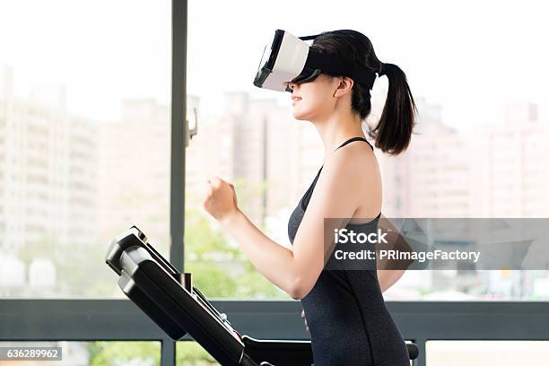 Beauty Asian Woman Running Treadmill By Vr Headset Glasses Stock Photo - Download Image Now