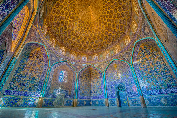Mosaic decoration inside of Sheikh Lotfollah Mosque, Isfahan Mosaic decoration made of tiles inside the famous Sheikh Lotfollah Mosque. This mosque is one of the architectural masterpieces of Safavid Iranian architecture, standing on the eastern side of Naghsh-i Jahan Square (also known as Imam or Shah Square) in Isfahan, Iran. The construction of the mosque dates back to 1603 until 1615. isfahan stock pictures, royalty-free photos & images