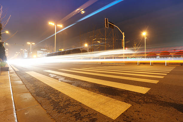 istock Urban road, modern city at night 636294364