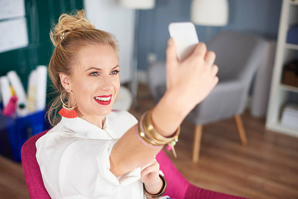 istock Close up of woman taking selfie 636294572