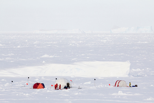 Polar research ice camp over a drifting ice floe in Antarctica