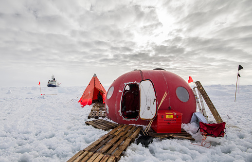 Polar research ice camp over a drifting ice floe in Antarctica