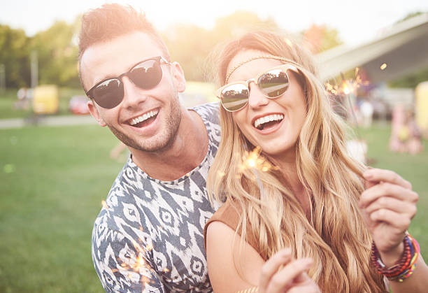 istock Holding sparklers at the festival 636296546