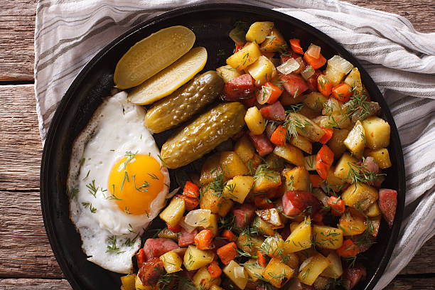 istock Norwegian food pyttipanne: fried potatoes with sausages, eggs 636298350