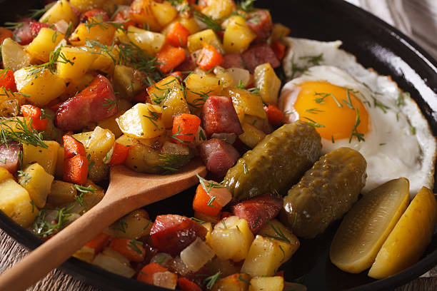 istock Scandinavian breakfast: pyttipanna with fried eggs and pickled 636298504