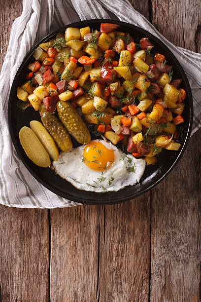 istock Finnish food pyttipannu: fried potatoes with sausages, eggs 636299136