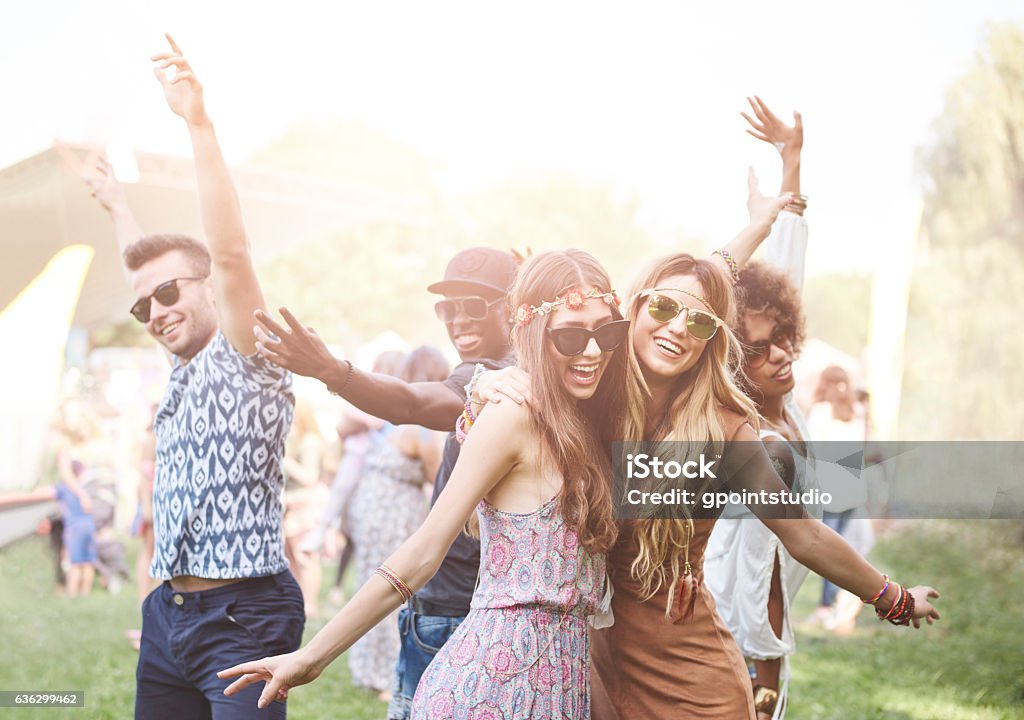 Enthusiastic crowd surfing at music festival Music Festival Stock Photo