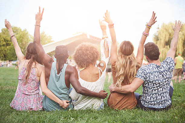 Young people cheering and chilling outside