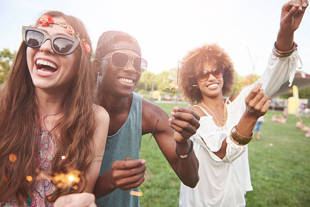 istock Young and happy people with sparklers 636299842