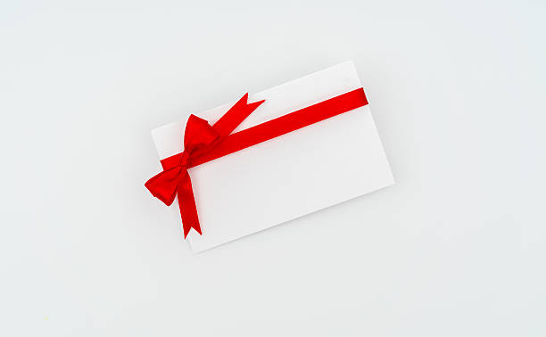 istock Blank card with red ribbon on white background 636300294