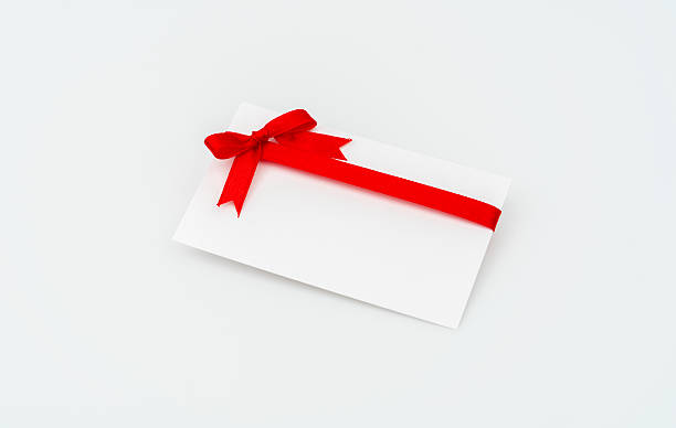 istock Blank card with red ribbon on white background 636300406