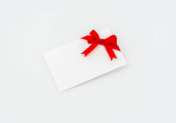 istock Blank card with red ribbon on white background 636300474