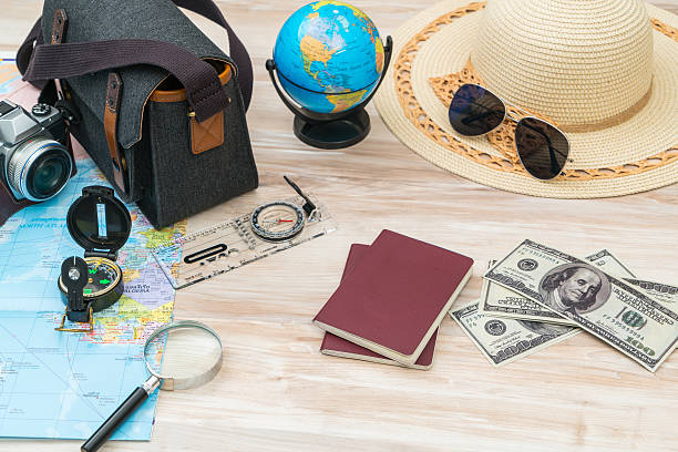 istock Travel items on hardwood floor 636303056