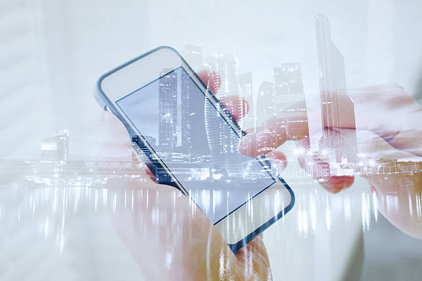 istock double exposure of hands with smart phone 636303440