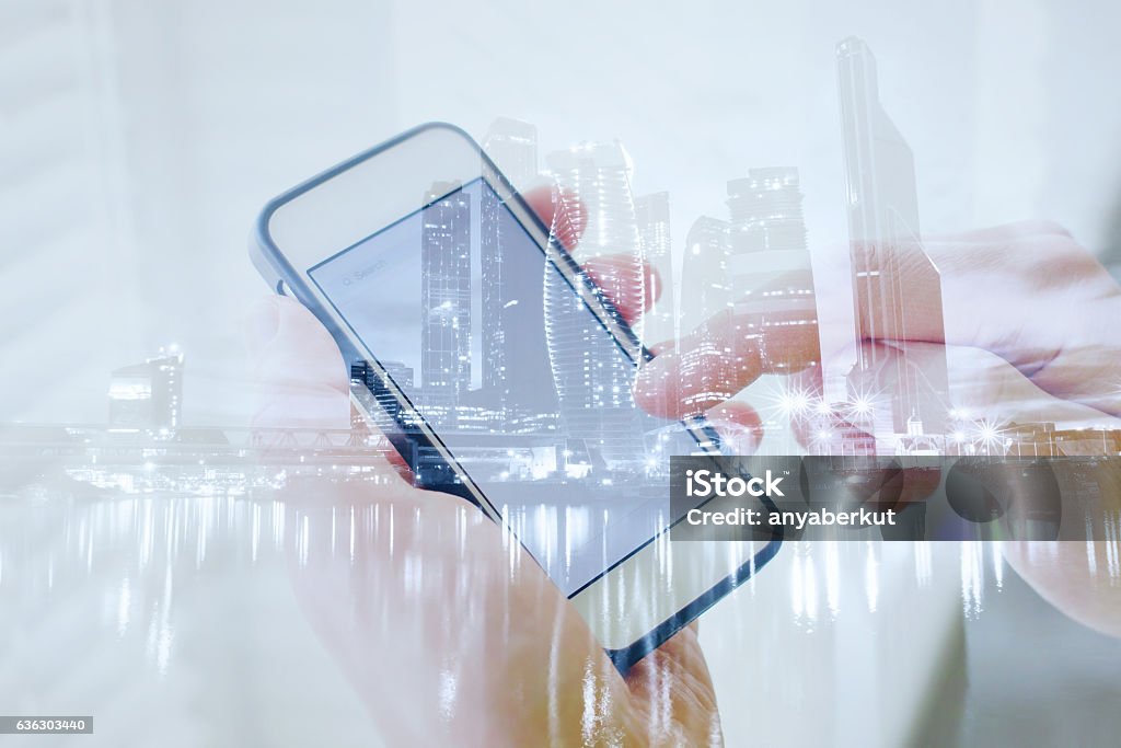 double exposure of hands with smart phone double exposure of hands with smart phone, modern technology of mobile application Multiple Exposure Stock Photo