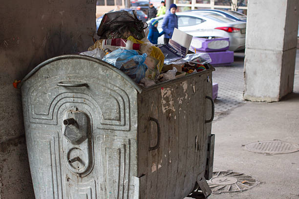istock Outdoor trash bin with food waste. Not sorted garbage, yard 636306550