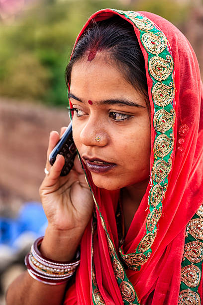 istock Young Indian woman using mobile phone, Jodhpur, India 636307648