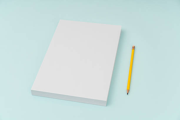 istock Blank paper with pencil on blue background 636308788