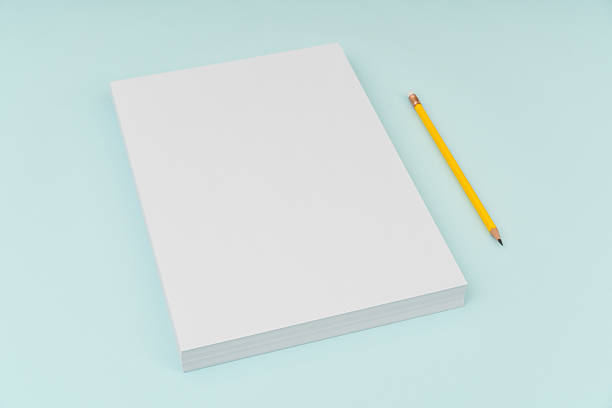 istock Blank paper with pencil on blue background 636308806