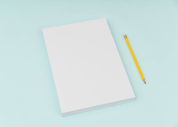istock Blank paper with pencil on blue background 636308824