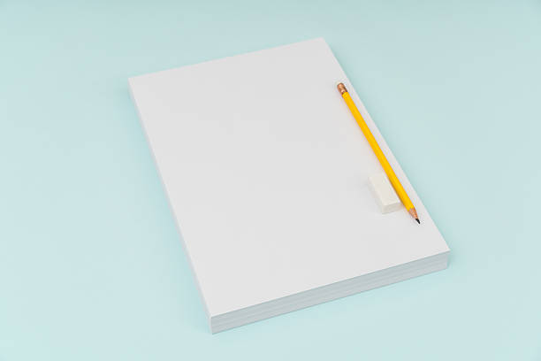 istock Blank paper with pencil and eraser on blue background 636308866