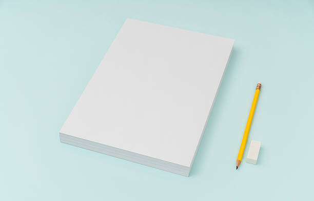 istock Blank paper with pencil and eraser on blue background 636308912