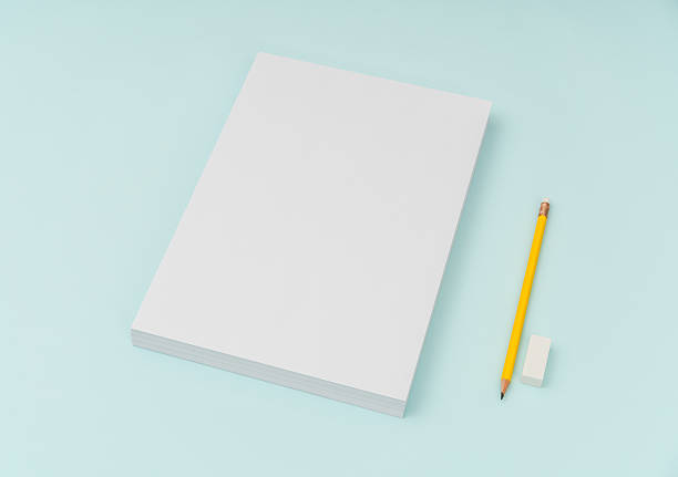 istock Blank paper with pencil and eraser on blue background 636308934
