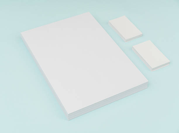 istock Blank paper and businesscard on blue background 636309104