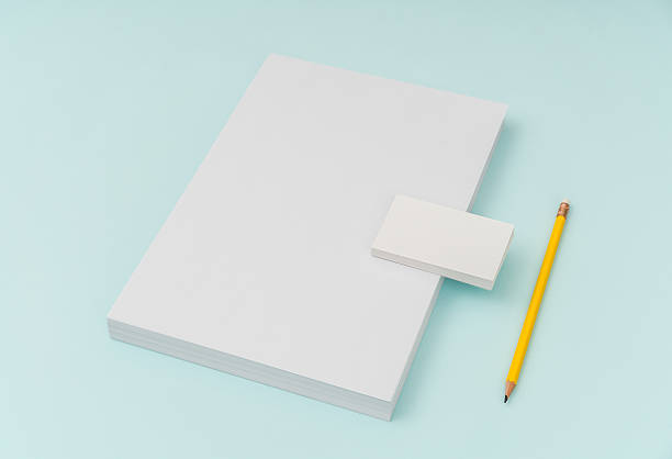 istock Blank paper, businesscard and pencil on blue background 636309202