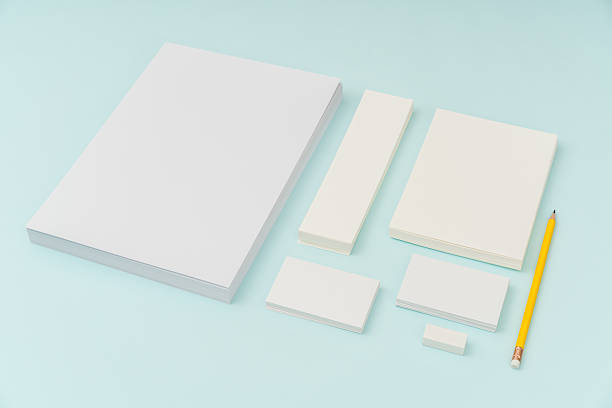 istock Blank paper with pencil on blue background 636312374