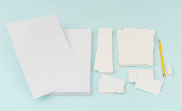 istock Blank paper with pencil on blue background 636312414