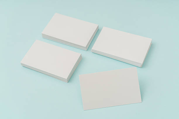 istock Blank business cards on blue background 636312718