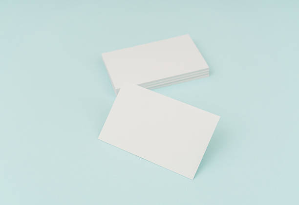 istock Blank business cards on blue background 636312742
