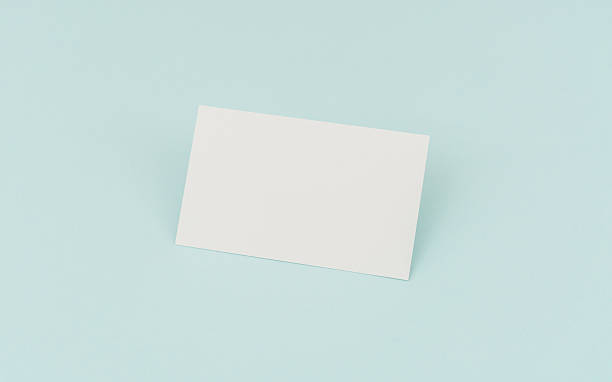 istock Blank business cards on blue background 636312820