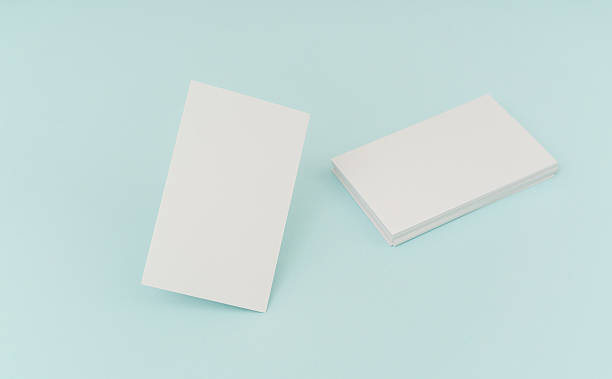istock Blank business cards on blue background 636313020