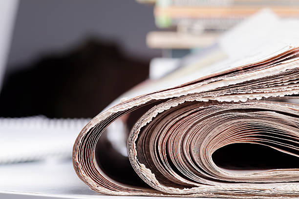istock Stack of newspaper extreme close up with copy space 636314020
