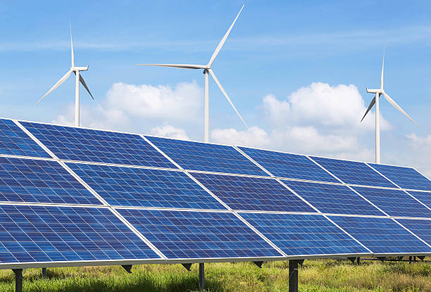 istock solar panels and wind turbines in power station 636314364