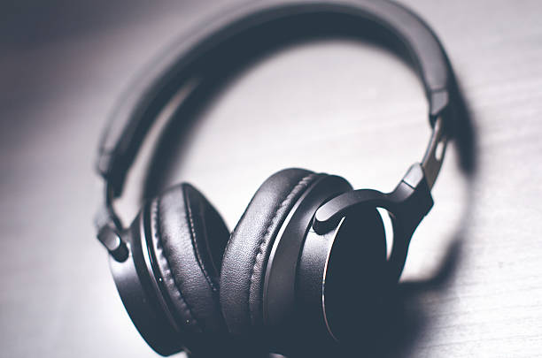 istock Headphones on a dark background. Music accessories. 636314868