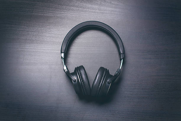 istock Headphones on a dark background. Music accessories. 636314916