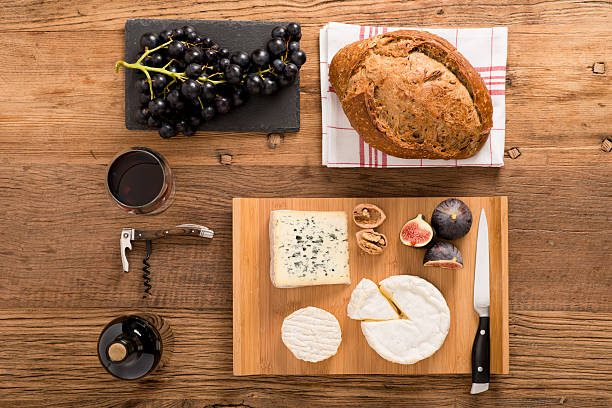 istock above view flatlay assortment cheese and wine wooden table copyspace 636314952